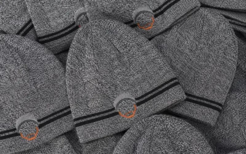 Pile of manufactured branded beanies ready to ship
