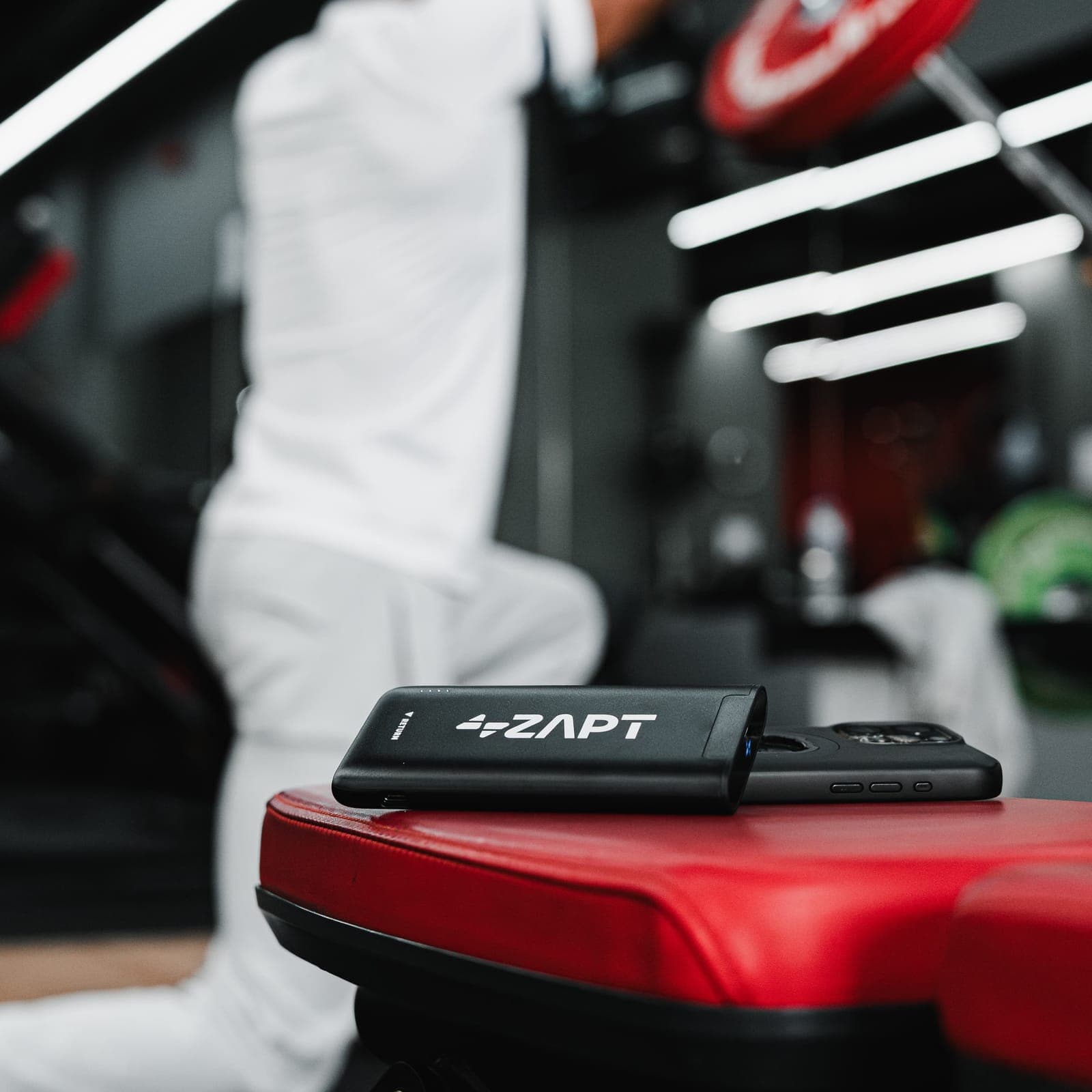 A ZAPT powerbank on a gym bench